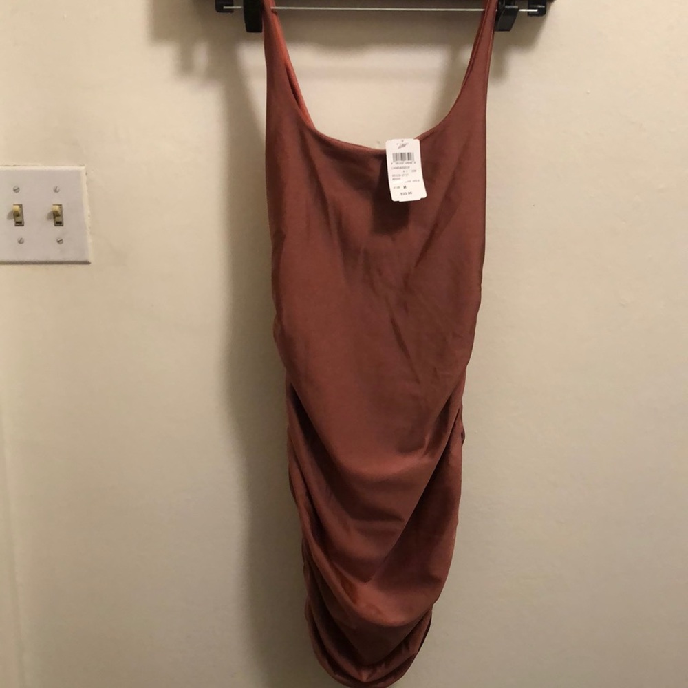 Flattering body con dress-like dress. Mauve rose gold.
